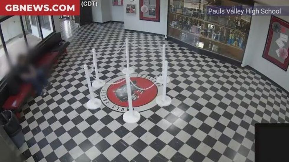 Watch the moment heroic school headteacher tackles and pins down armed shooter