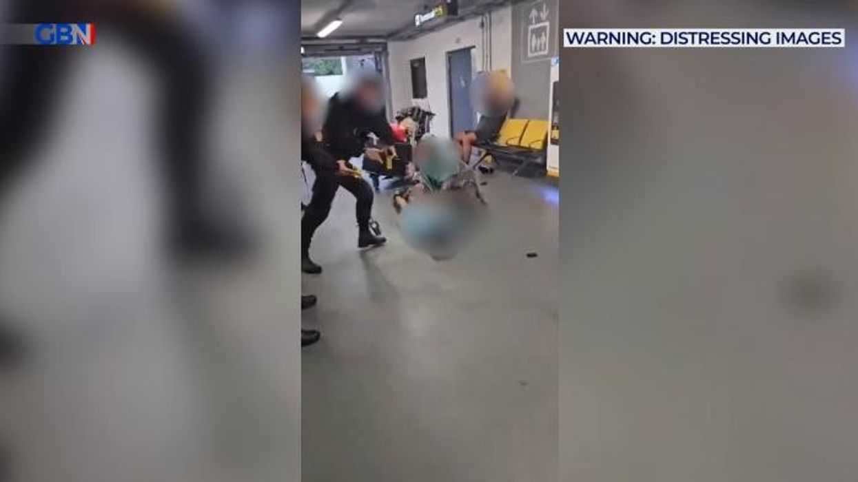 Police filmed stamping on suspect's head in shocking footage at Manchester Airport after 'violent assault' leaves three officers in hospital and four men arrested