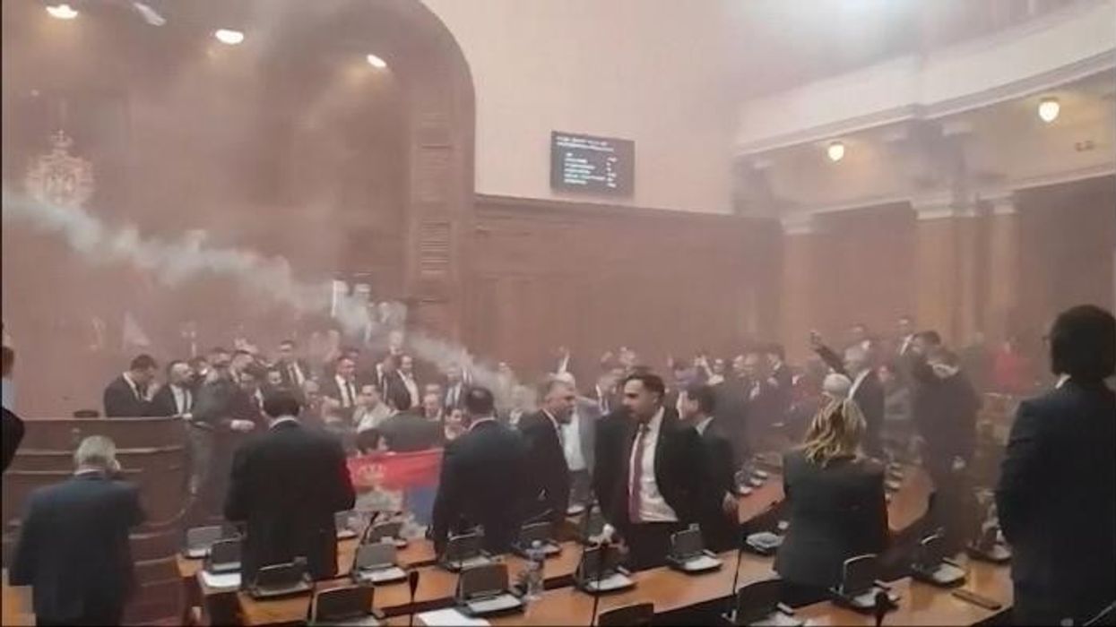 Serbian MP suffers stroke after smoke grenades cause chaos inside parliament