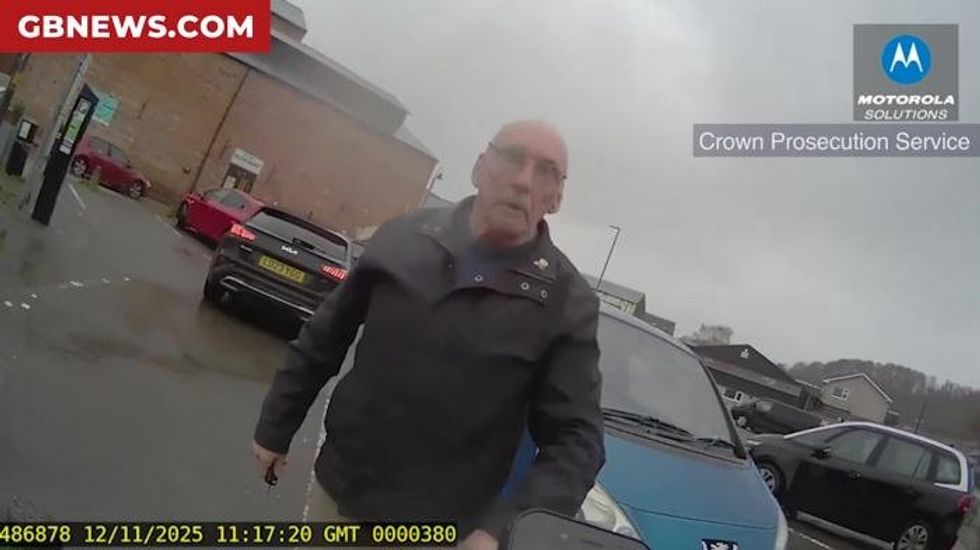 Watch the moment furious 77-year-old slaps traffic warden and threatens to 'lump' her