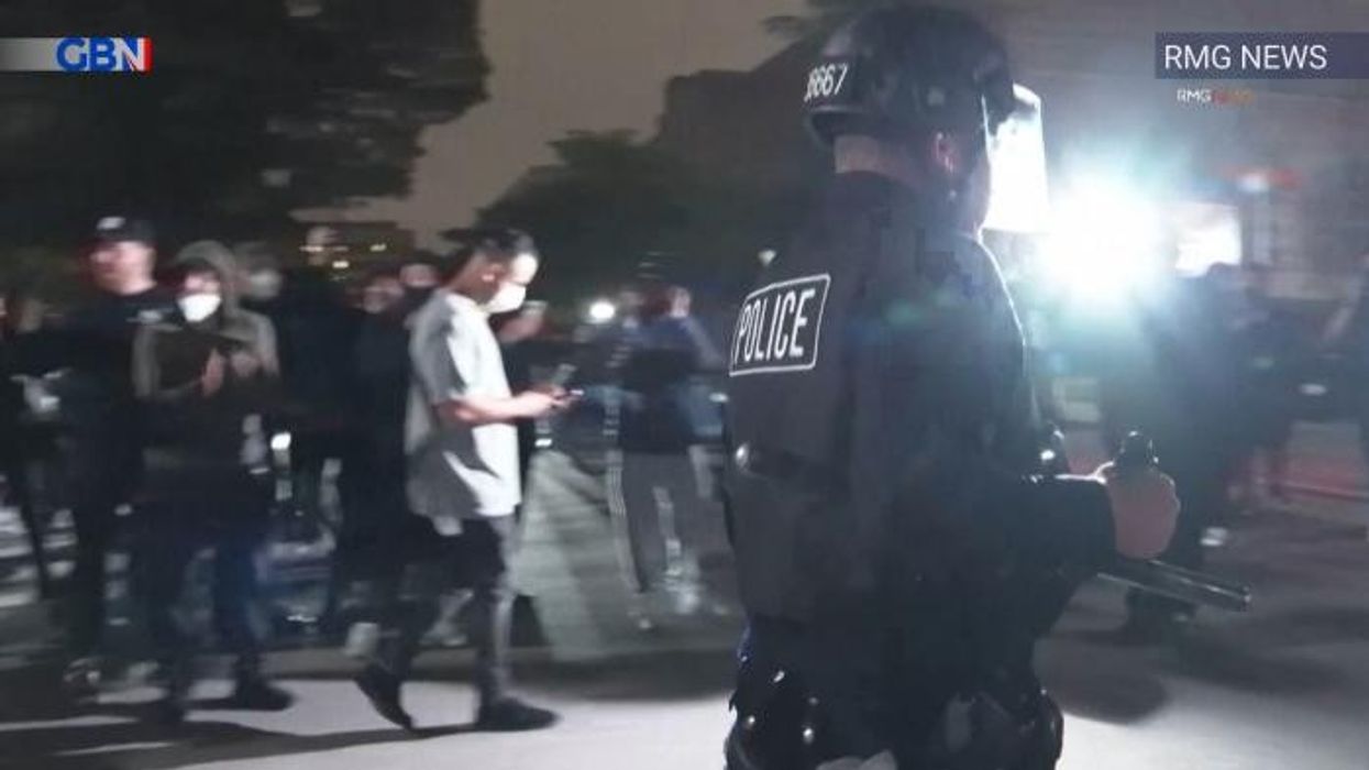 Pro-Palestine protesters clash with police on UCLA campus just hours after officers stormed Columbia and arrested dozens