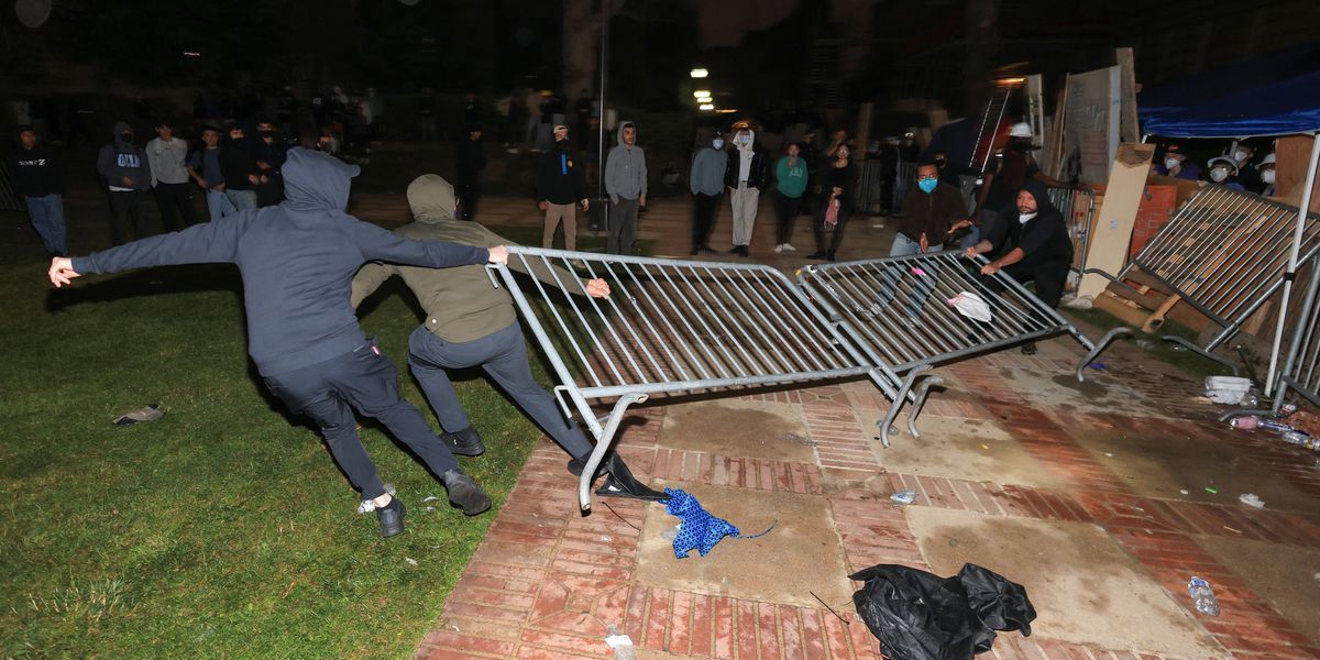 NextImg:Pro-Palestine protesters clash with police on UCLA campus just hours after officers stormed Columbia and arrested dozens