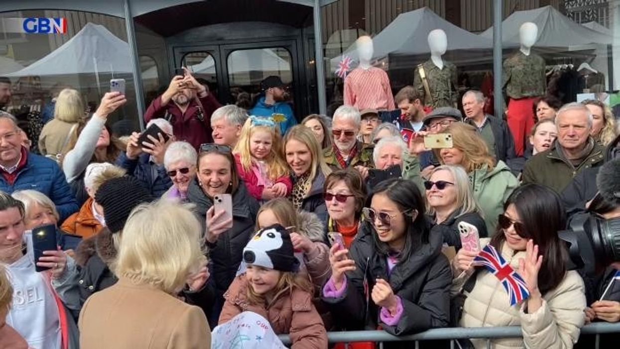Queen Camilla beams in front of huge crowds as she steps up for Royal Family