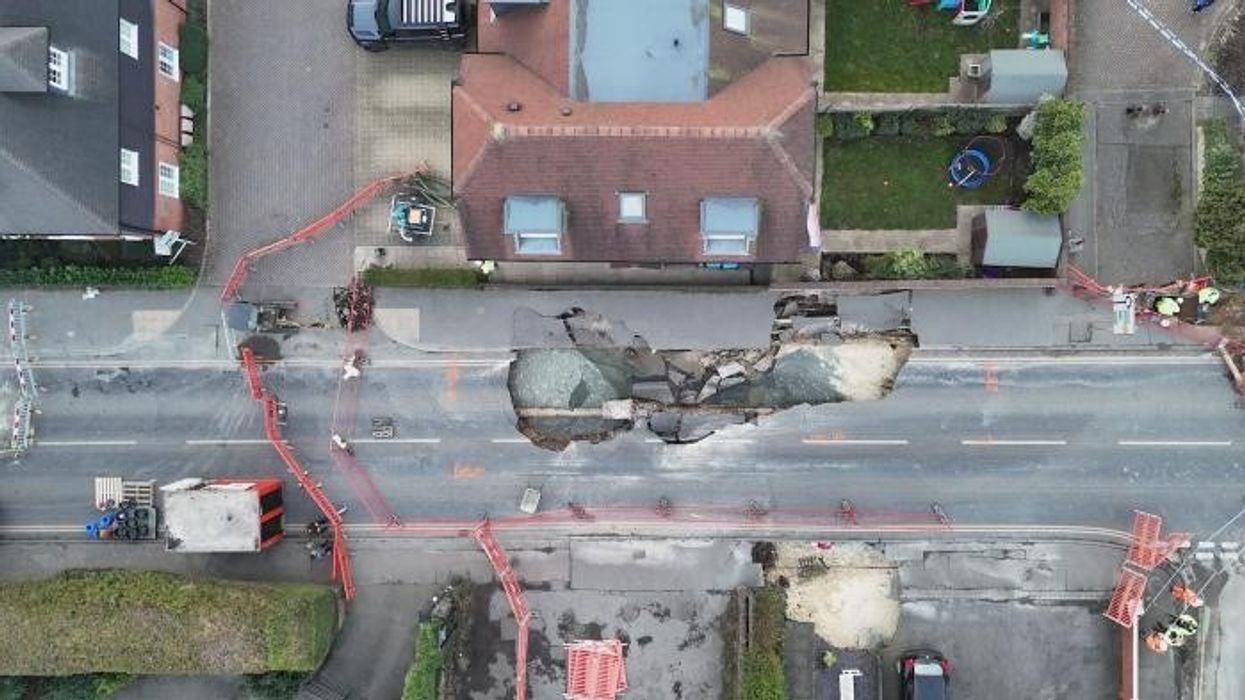 Major incident declared as massive 60ft sinkhole opens up in leafy Surrey village