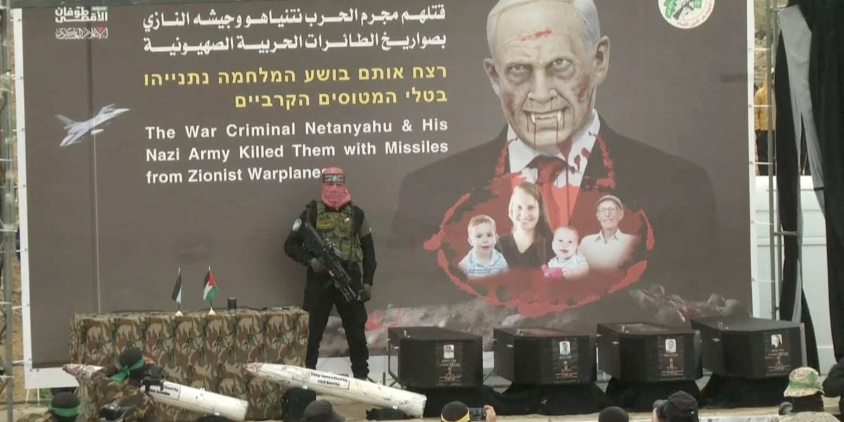 NextImg:Hamas unveil horror display of four coffins on stage as terrorists hand over bodies of October 7 hostages including nine-month-old baby