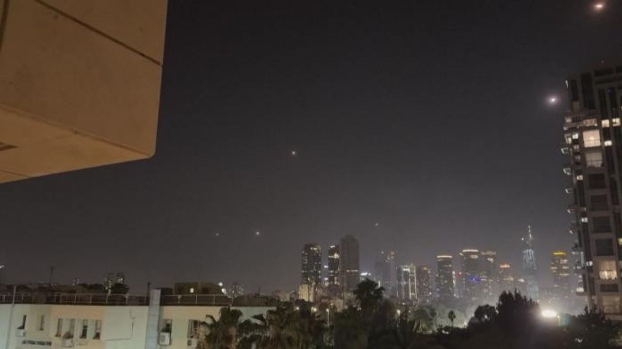 WATCH: Terrifying moment Iranian missiles rain down on Tel Aviv as Israelis rush for safety