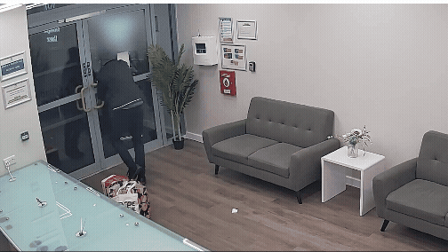 Watch the moment inept burglar frantically fails to open door after student accommodation raid