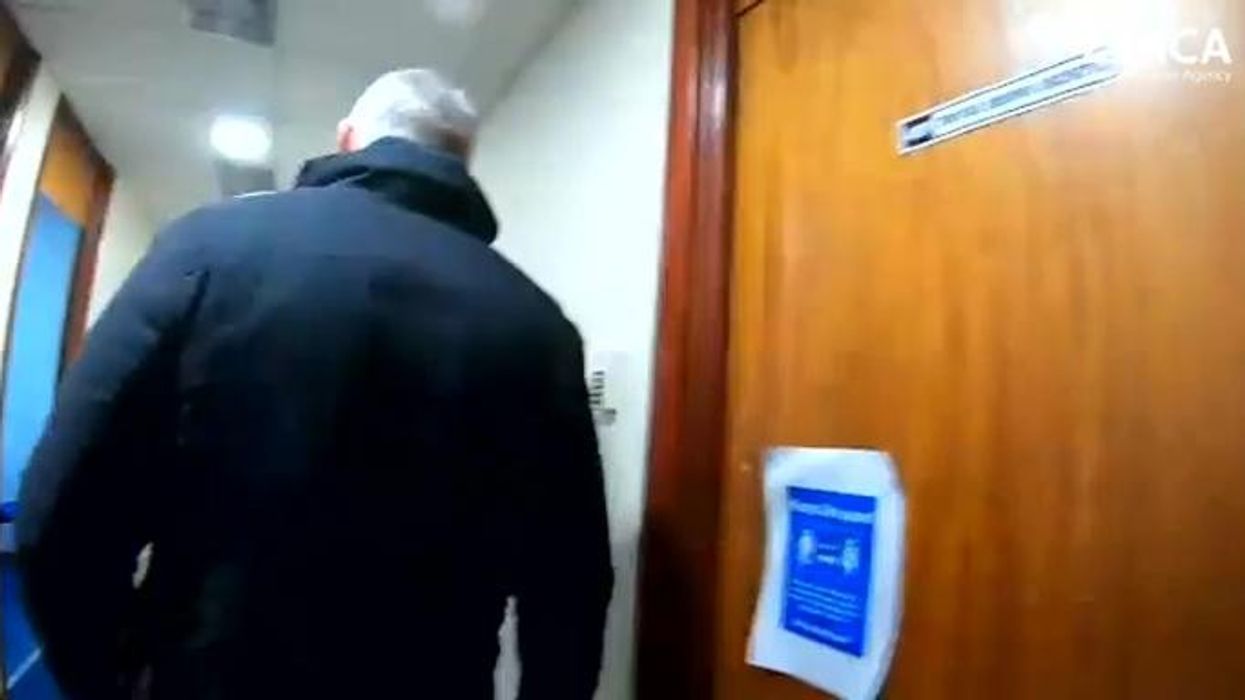 Watch the moment officers arrest Iranian national accused of laundering £1.6m for people smugglers