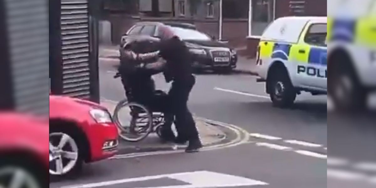 NextImg:Horrifying video shows police officer punching one-legged man in wheelchair