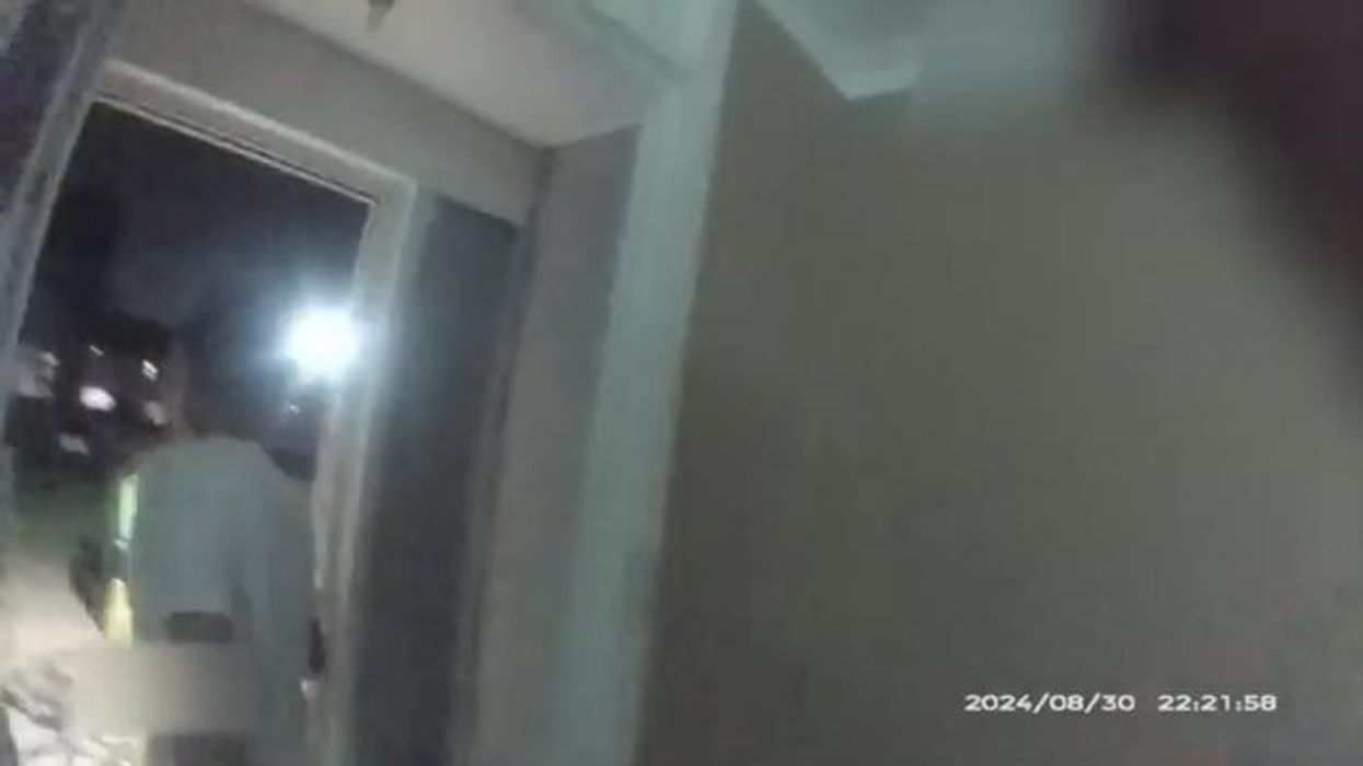 Watch shocking moment that man tries to STRANGLE police officer as he is being arrested