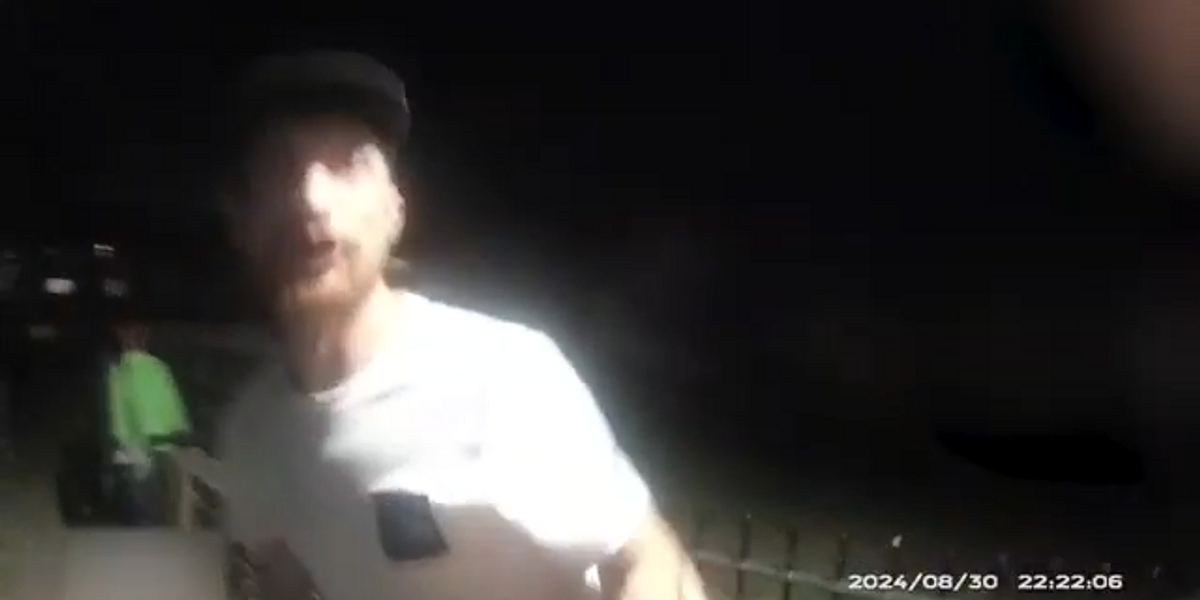 NextImg:Watch shocking moment that man tries to STRANGLE police officer as he is being arrested