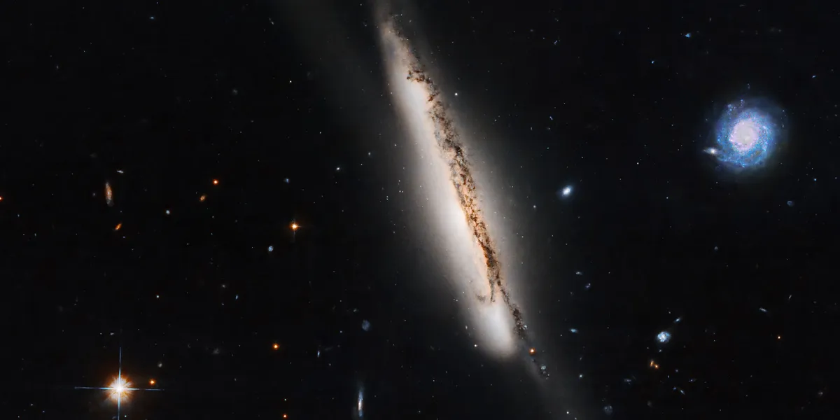 NextImg:Hubble Telescope pictures 'bridge of stars' connecting two colliding galaxies