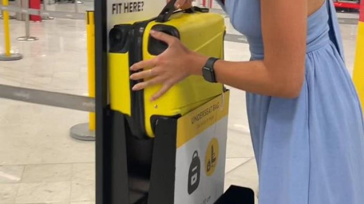Vueling passenger seen cramming carry-on bag into 'size checker' in defiance of airport busybodies