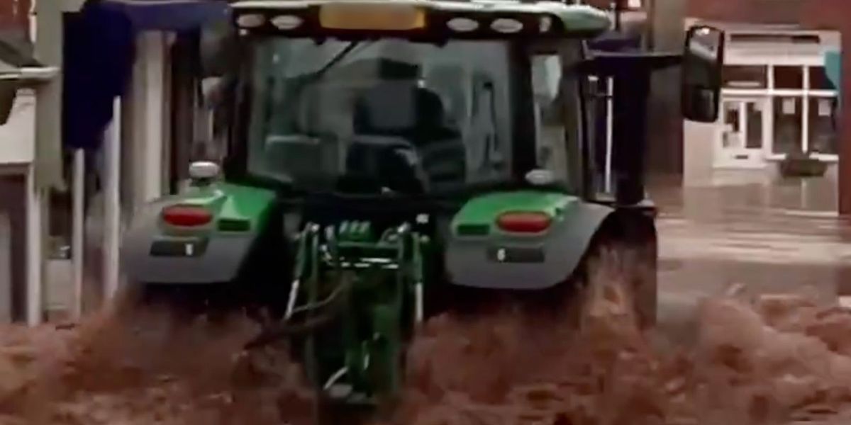 NextImg:Man arrested after tractor destroys shops on flooded high street