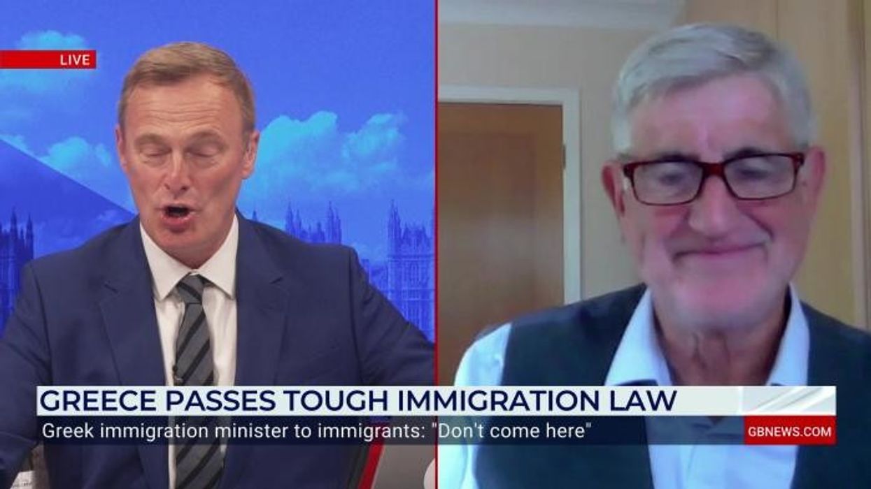 'Look at this mess!' Fury boils over in Greece after beachgoers spotted pushing migrant boat back into the sea