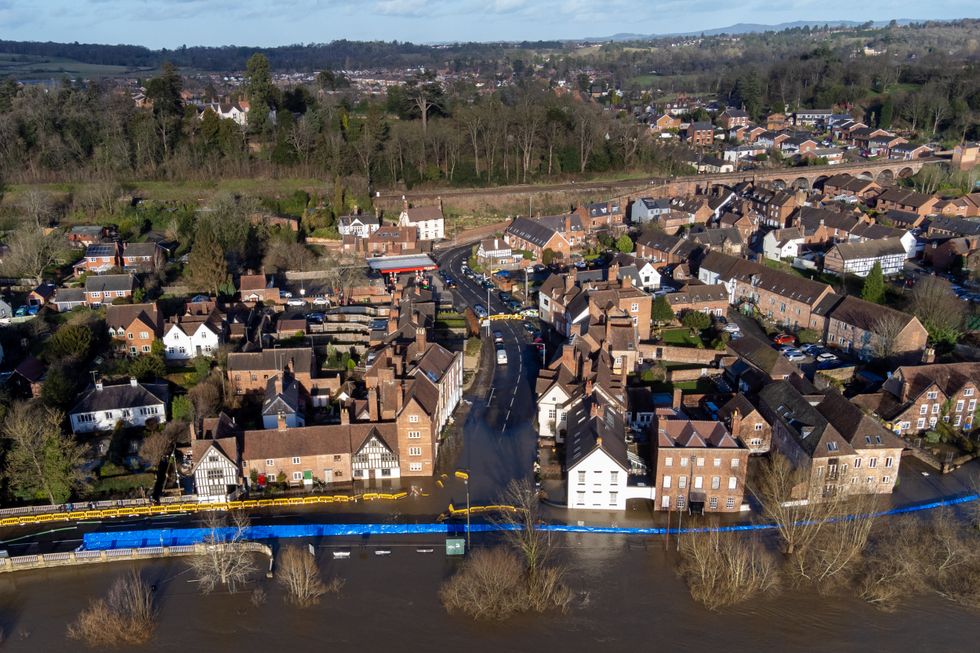 Water begins to spill behind flood defences along the River Severn at Bewdley in Worcestershire. The Environment Agency has urged communities in parts of the West Midlands and the north of England, especially those along River Severn, to be prepared for significant flooding until Wednesday following high rainfall from Storm Franklin. Picture date: Tuesday February 22, 2022.