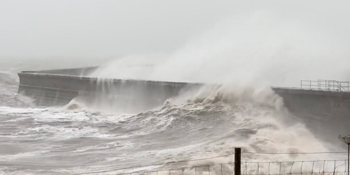 NextImg:Storm Debi: Huge waves crash into Cumbria shoreline as 70mph winds prompt ‘danger to life’ warnings