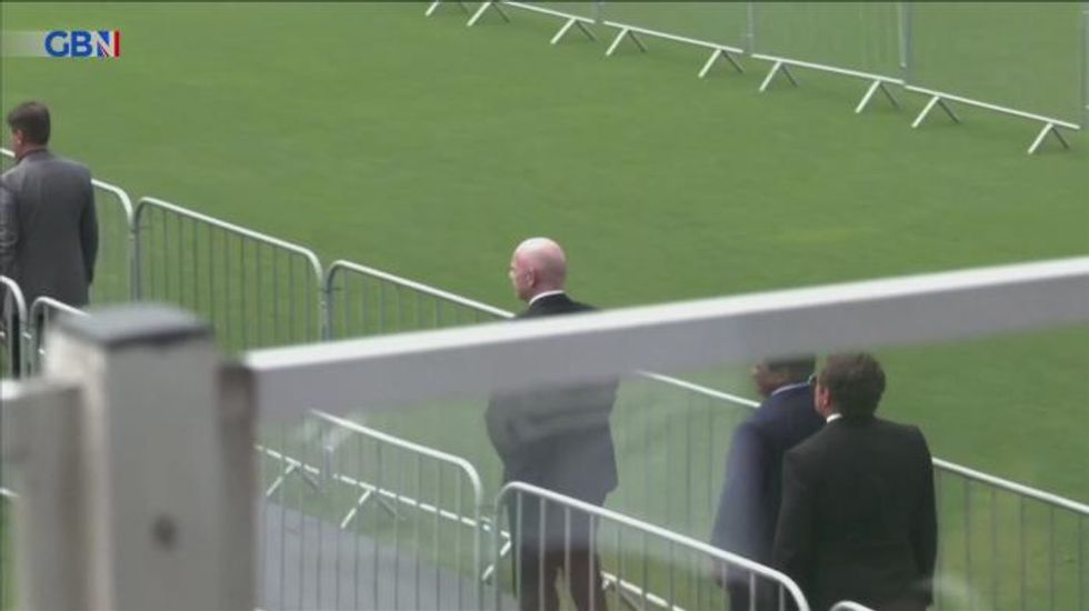 FIFA boss Gianni Infantino slammed for posing for SELFIE next to Pele's open coffin
