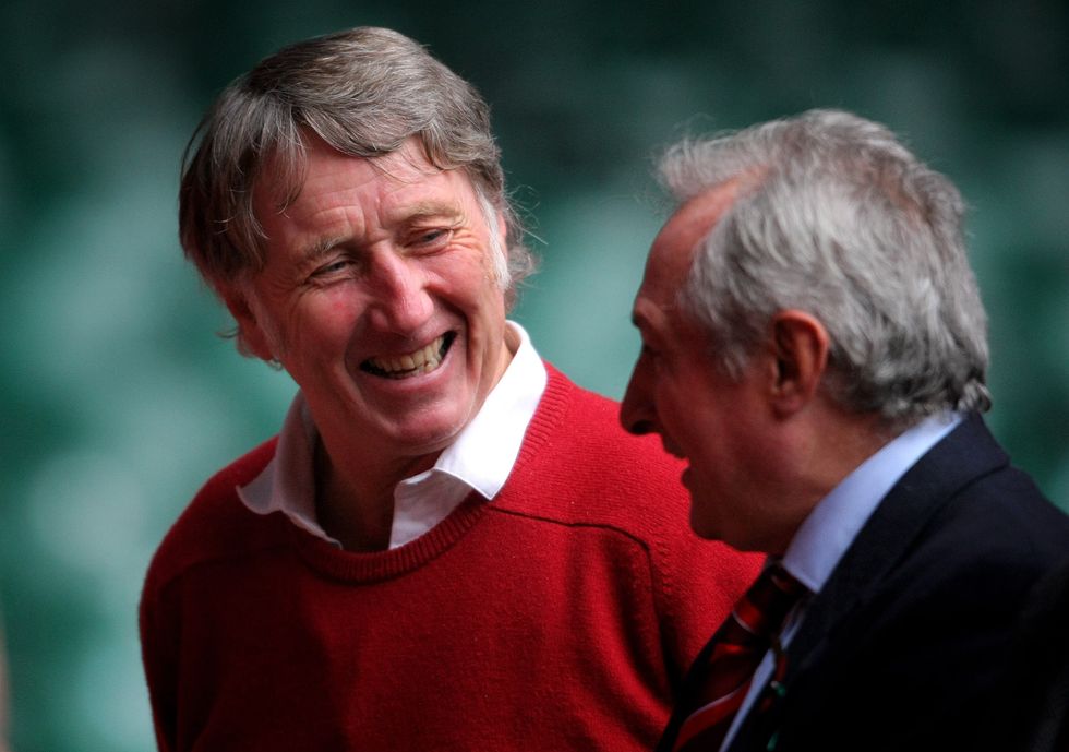 Welsh captain Phil Bennett (on ground) holds up England as JPR Williams gets the ball away for Wales