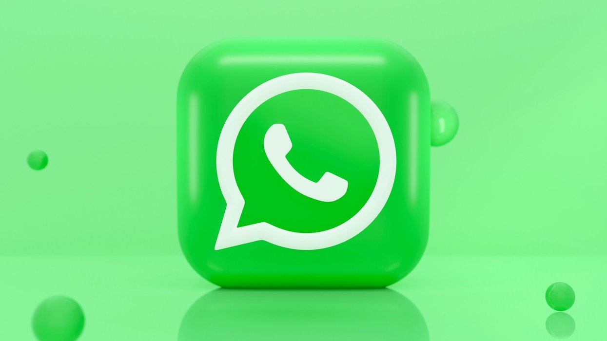 WhatsApp logo in front of green background