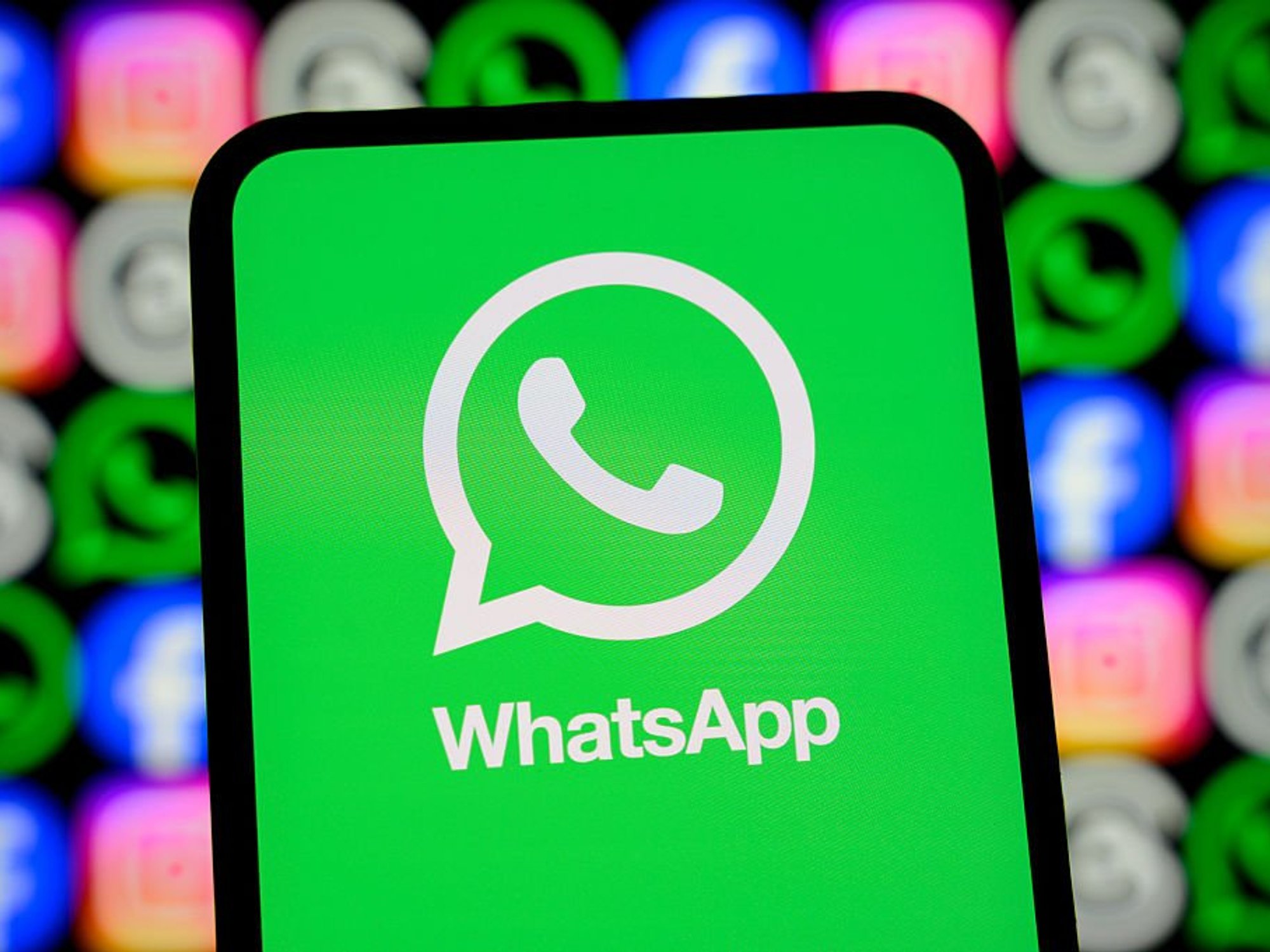 WhatsApp logo on phone