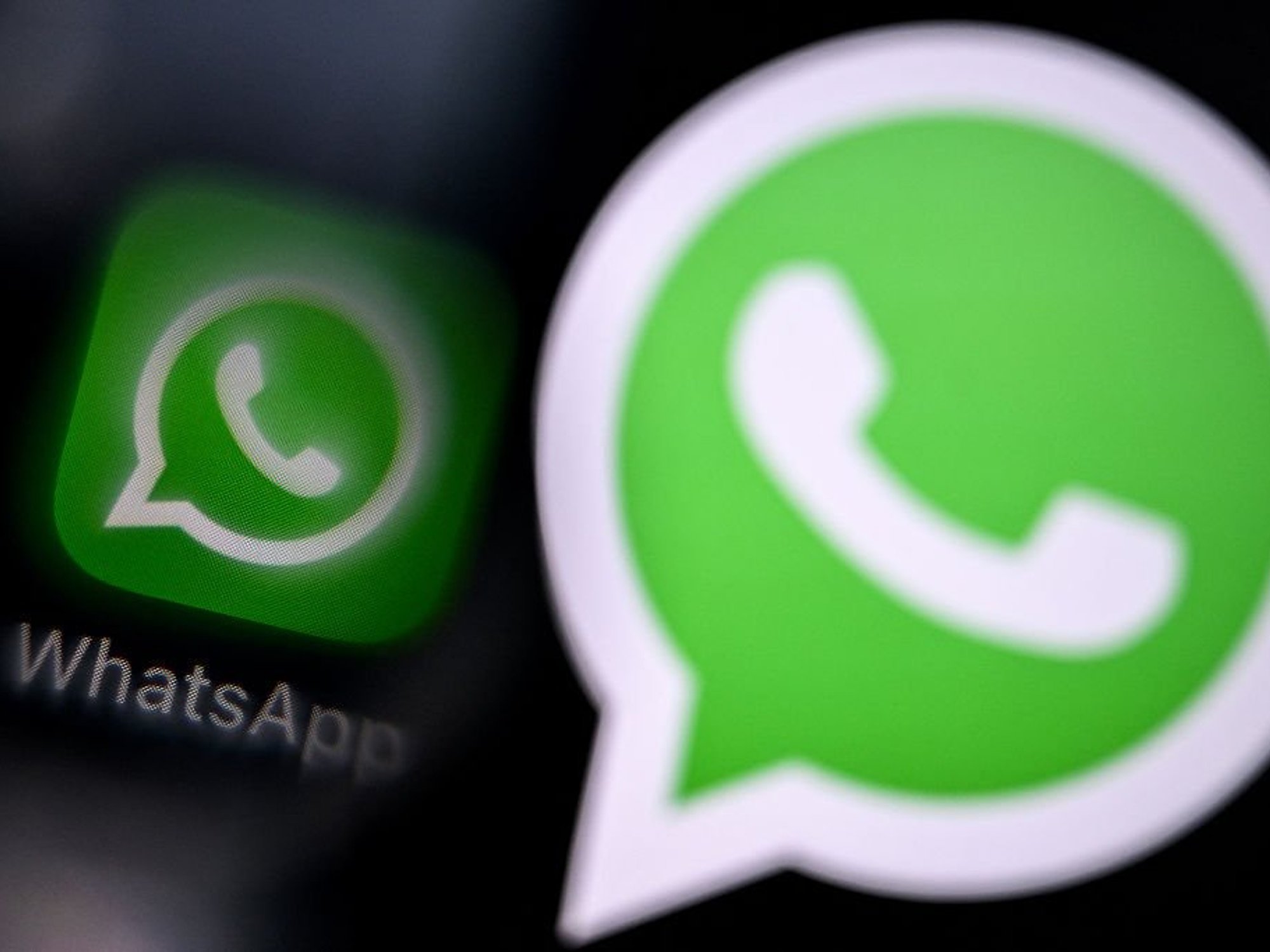 WhatsApp logo pictured next to a larger version of the same logo