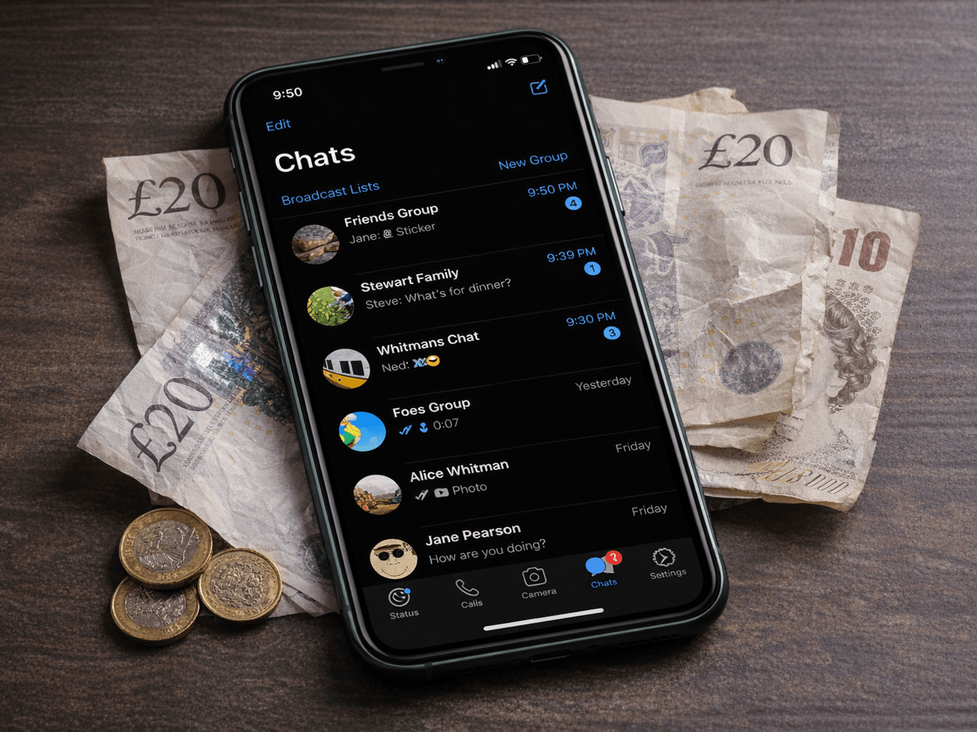 WhatsApp on phone surrounded with money on table