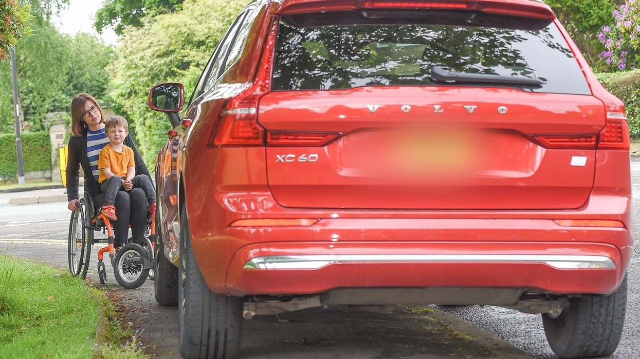 Wheelchair user obstructed by car