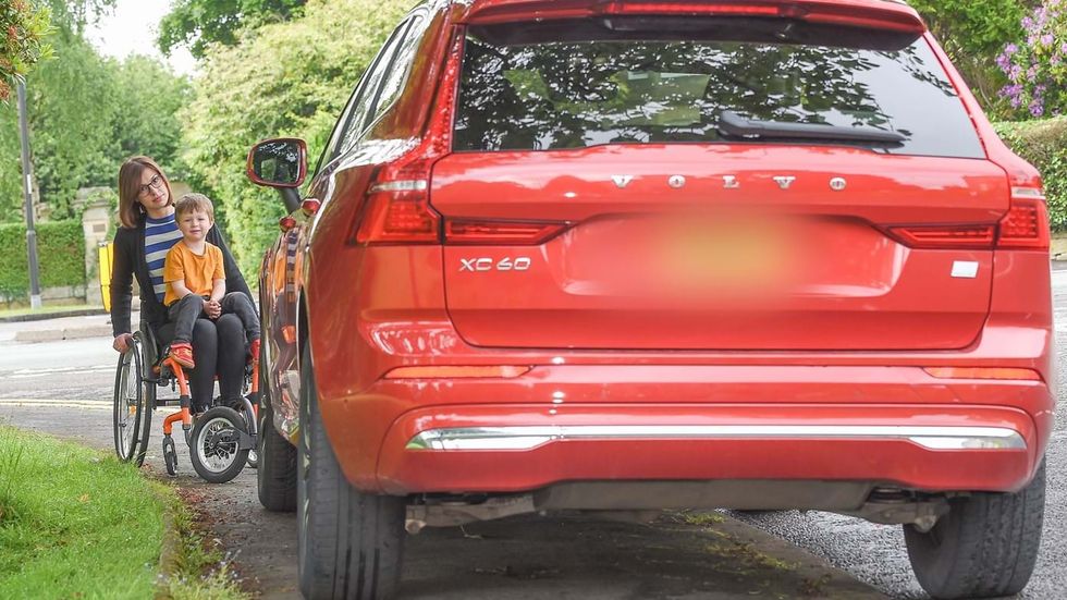 Wheelchair user obstructed by car