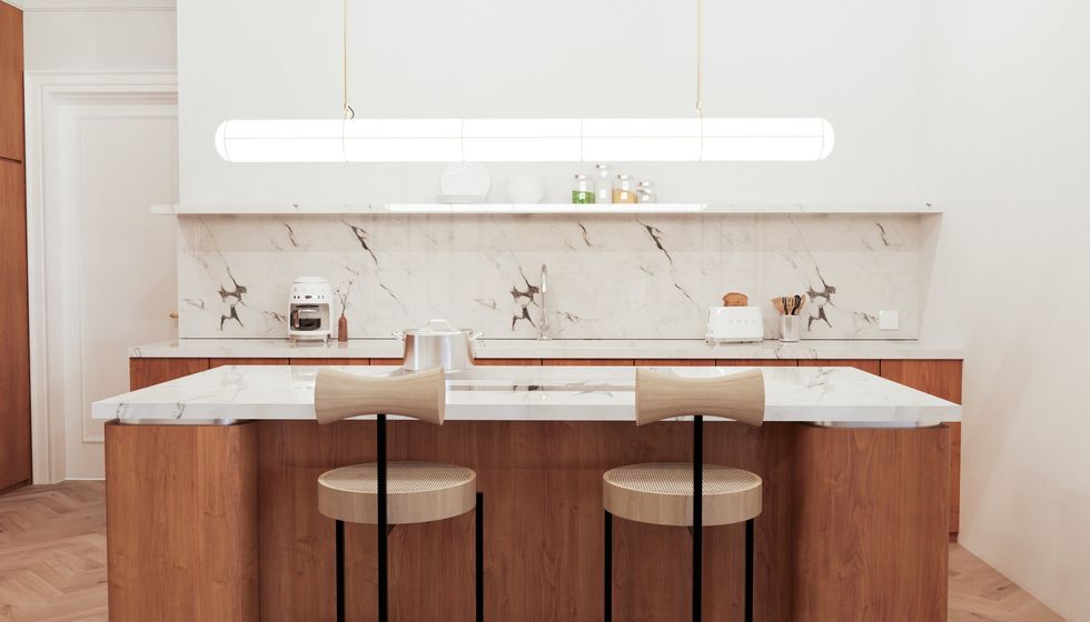 White marble countertops in wooden kitchen