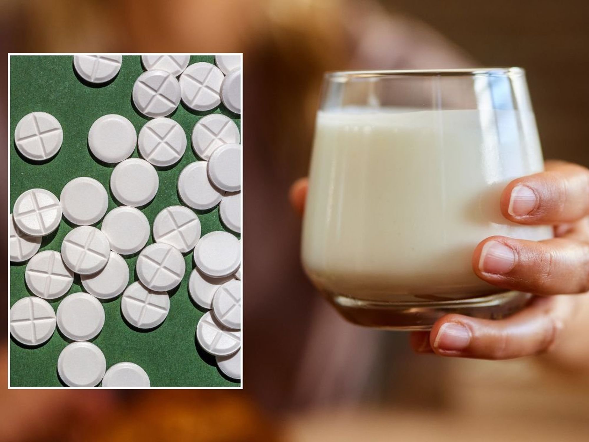 WHITE PILLS AND GLASS OF MILK