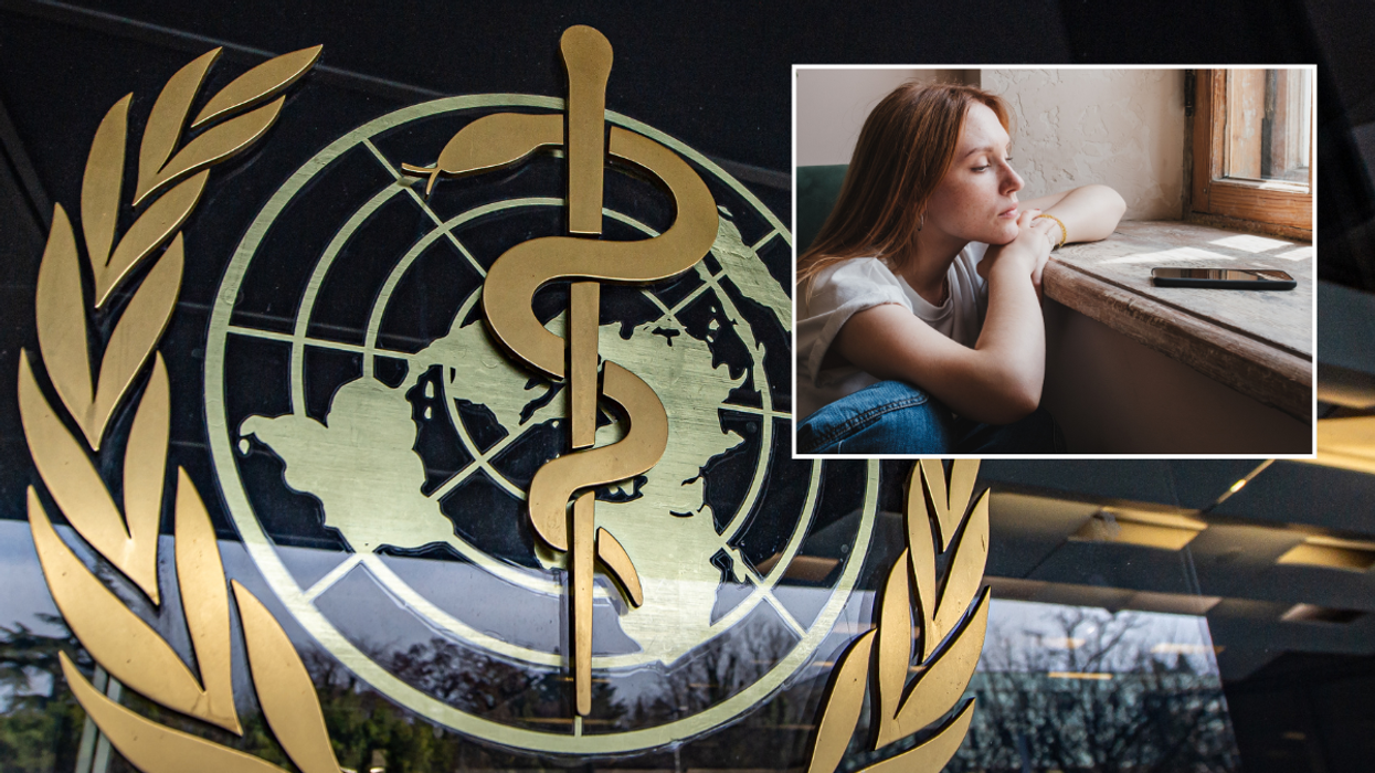 WHO logo; woman looking at her phone