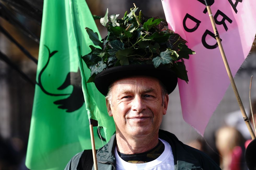 Wildlife expert Chris Packham and more than 100 children deliver a Wild Card campaign petition signed by 100,000, to Buckingham Palace, London, calling on the royal family to re-wild their estates.