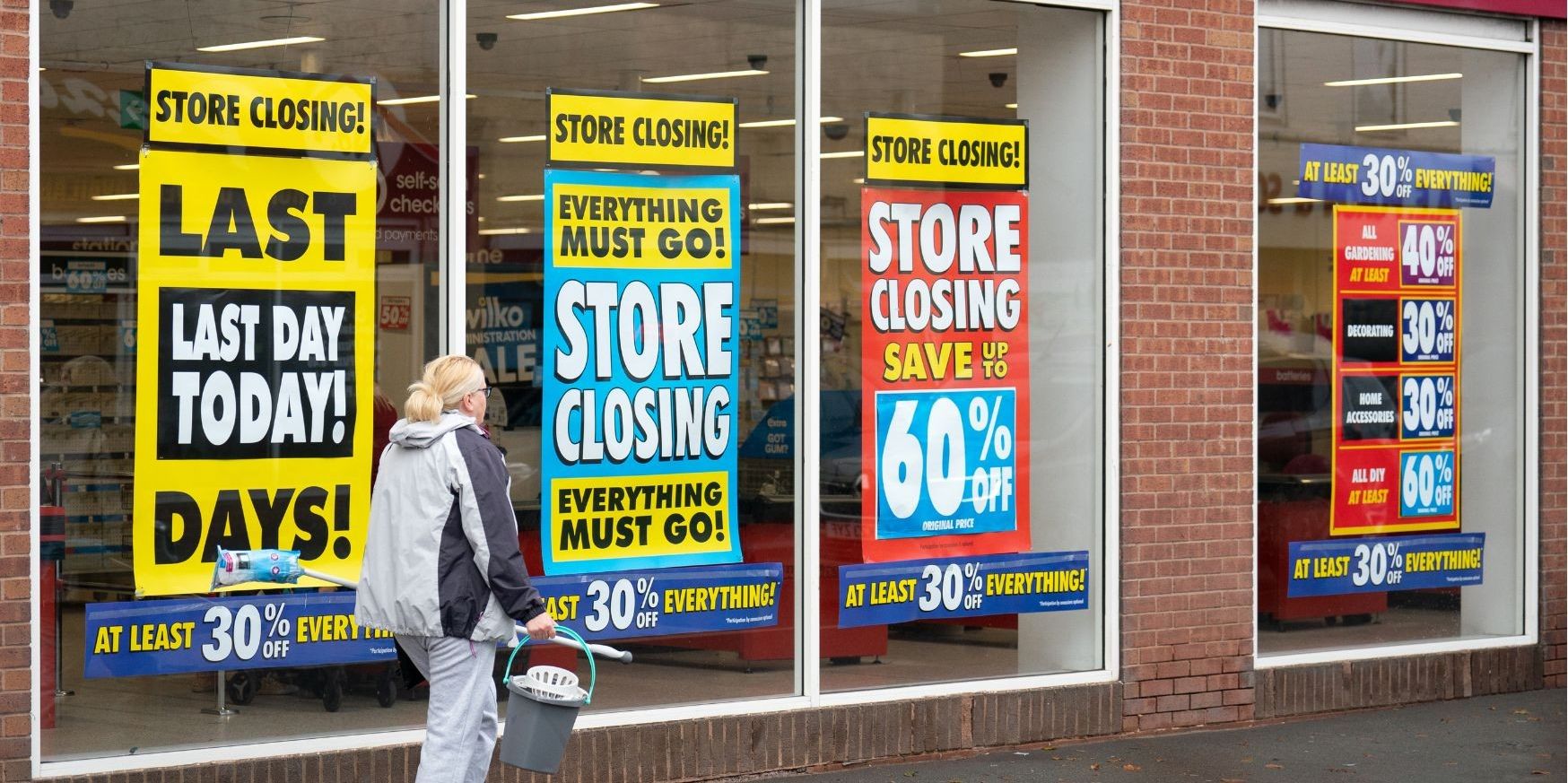 Wilko store with closing down sale signs in window