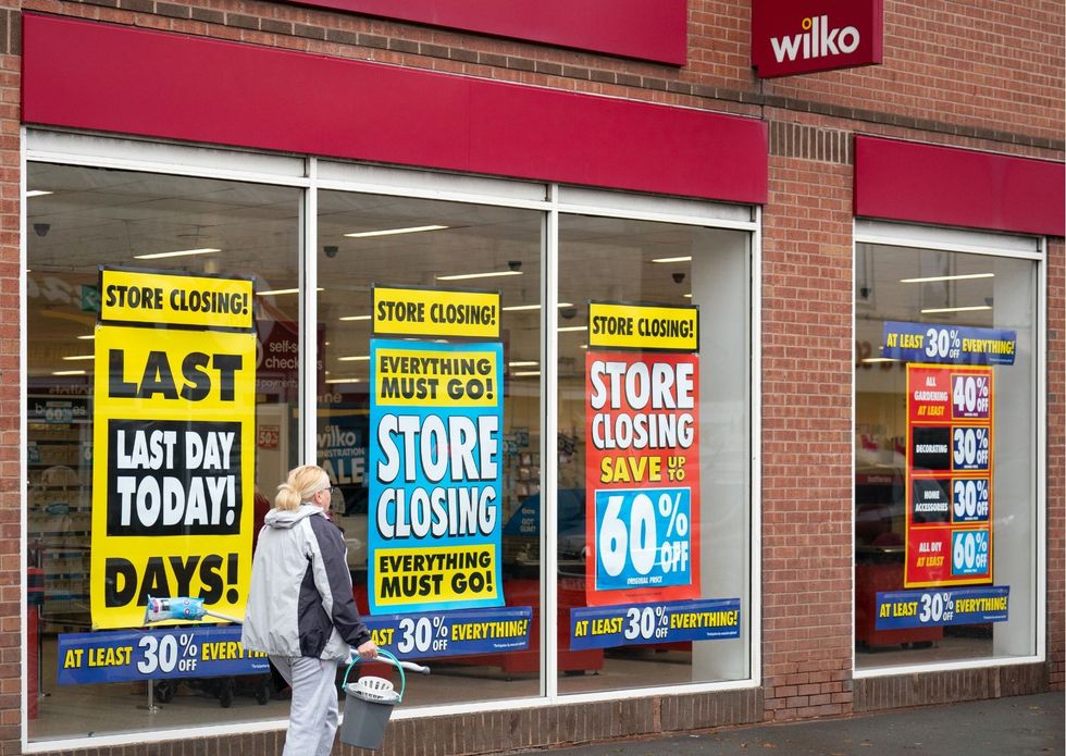 Wilko store with closing down sale signs in window