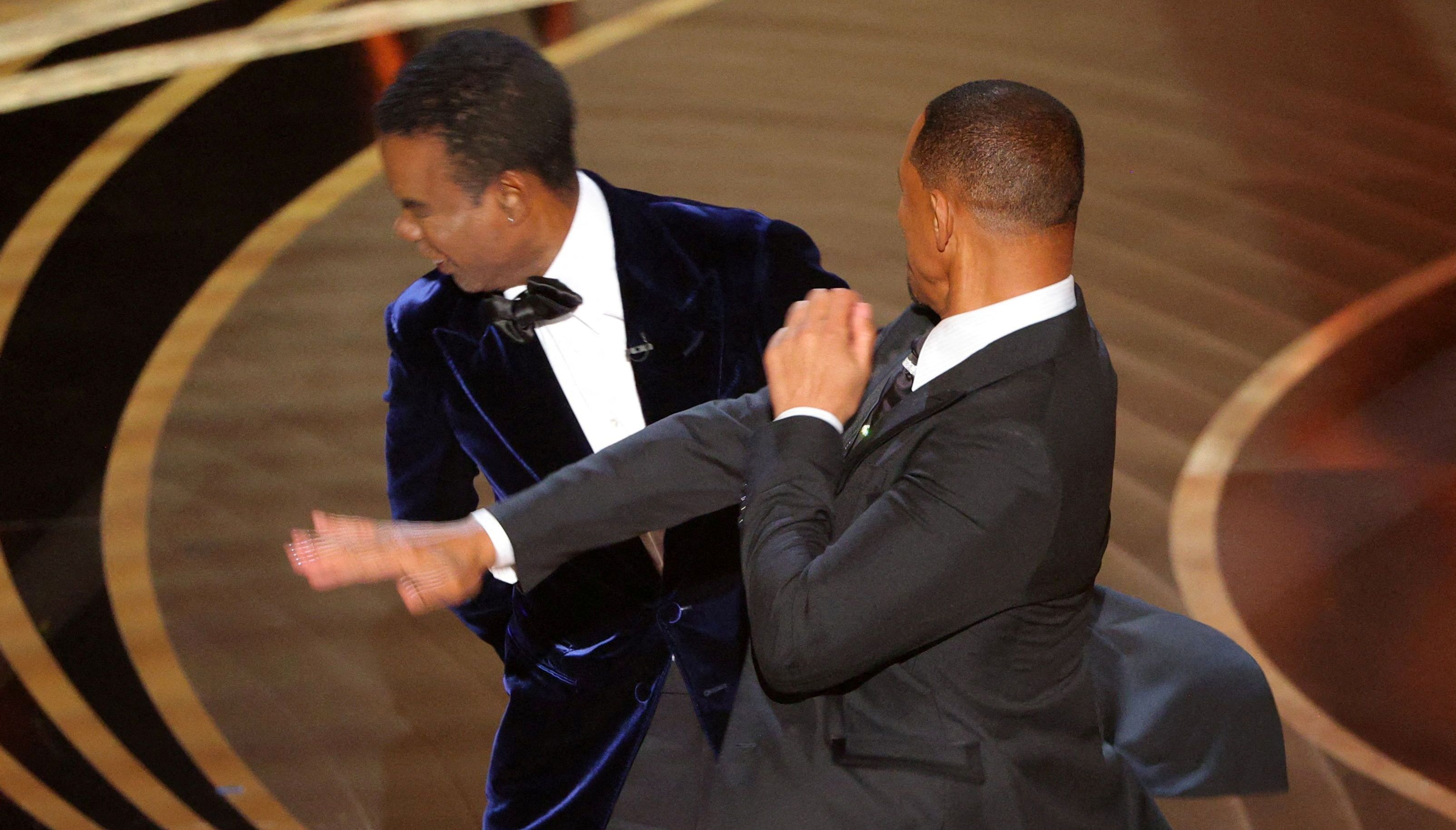 Will Smith hits at Chris Rock as Rock spoke on stage during the 94th Academy Awards in Hollywood, Los Angeles