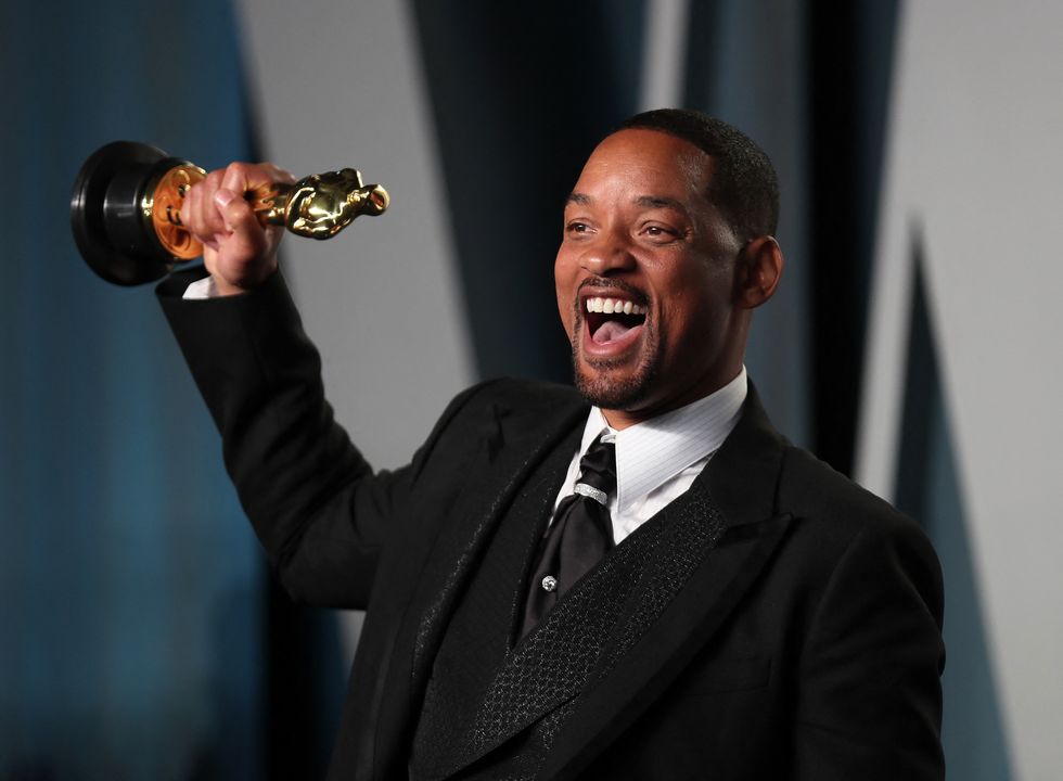 Will Smith poses with his Oscar as he arrives at the Vanity Fair Oscar party during the 94th Academy Awards in Beverly Hills, California, U.S., March 27, 2022. REUTERS/Danny Moloshok