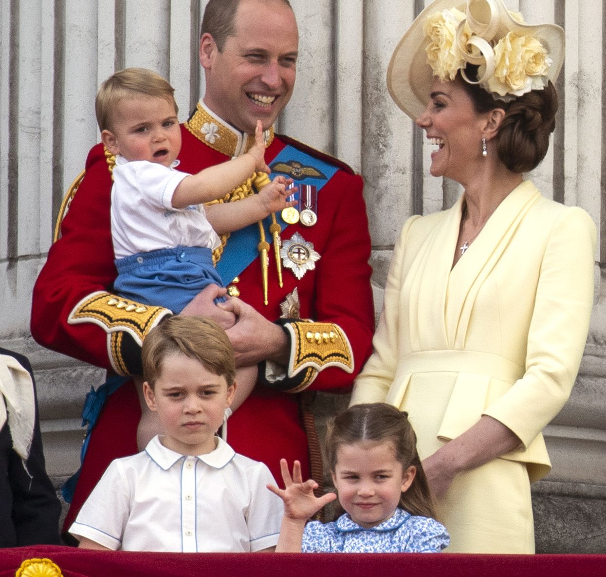 William and Kate are seen with their three children, Louis, Charlotte and George.