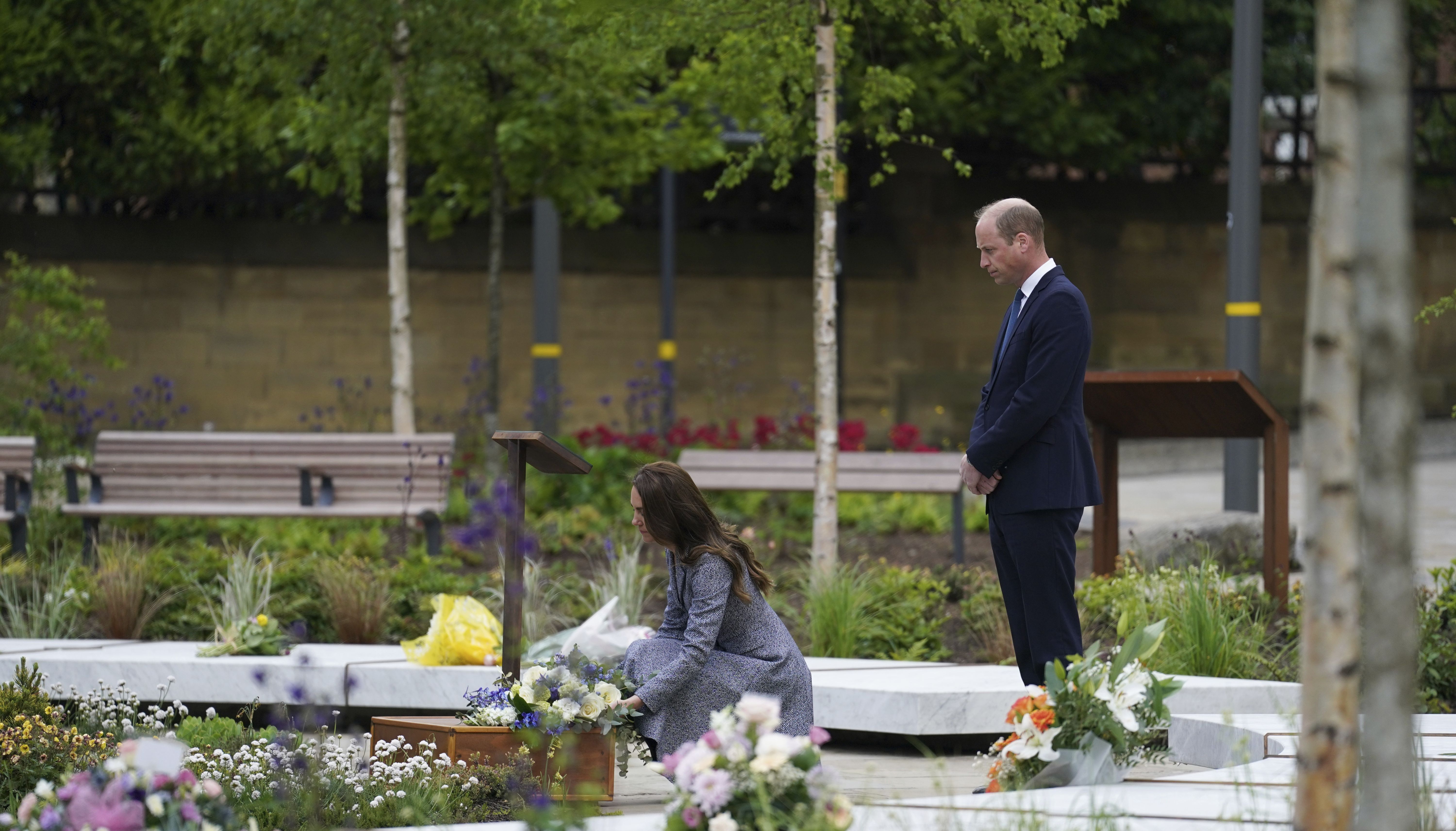 William and Kate lay flowers together at the Glade of Light Memorial.