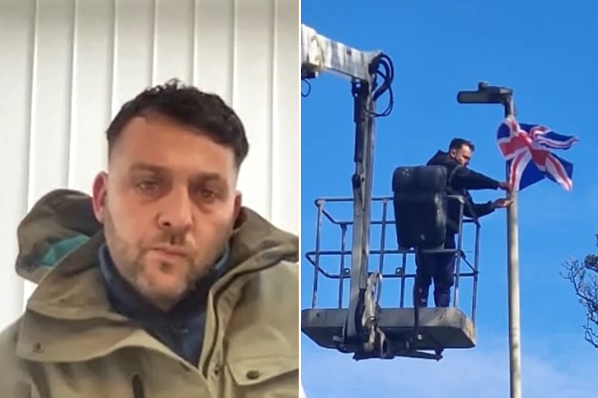 William Haylett; William Haylett tying flag to street light