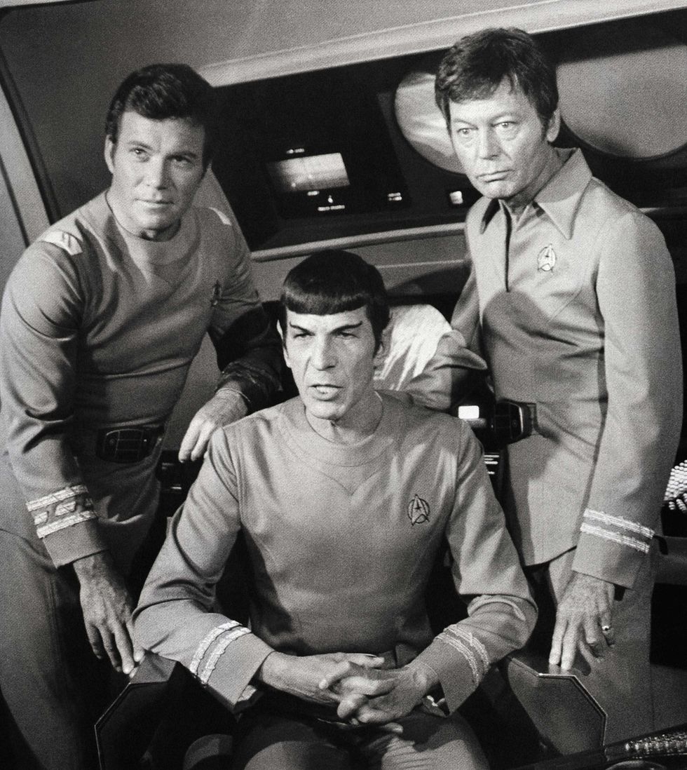 William Shatner alongside Leonard Nimoy and DeForest Kelley