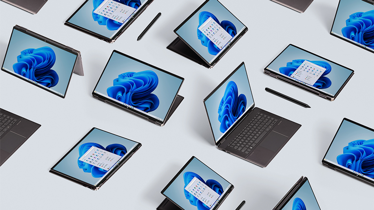 windows 10 laptops and tablet combos pictured arranged on the ground