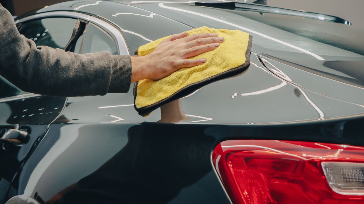 Wiping a car with a cloth