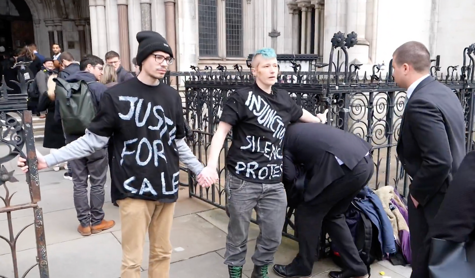 wo Just Stop Oil protesters glued to the Royal Courts of Justice
