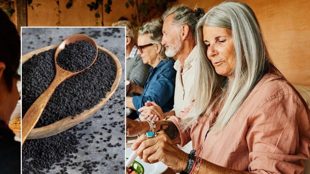 WOMAN AND BLACK CUMIN SEEDS