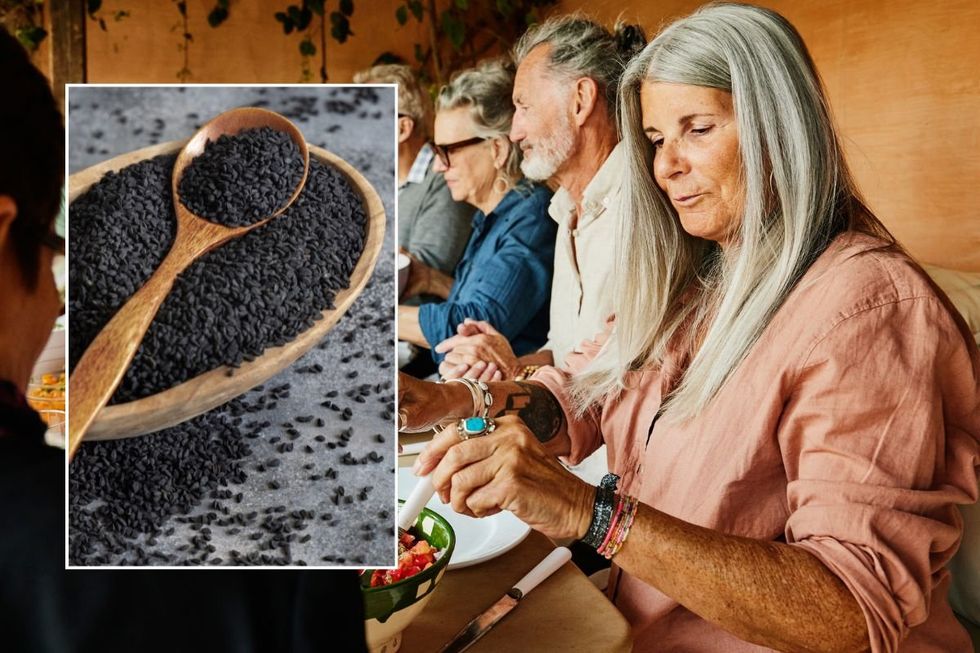 WOMAN AND BLACK CUMIN SEEDS