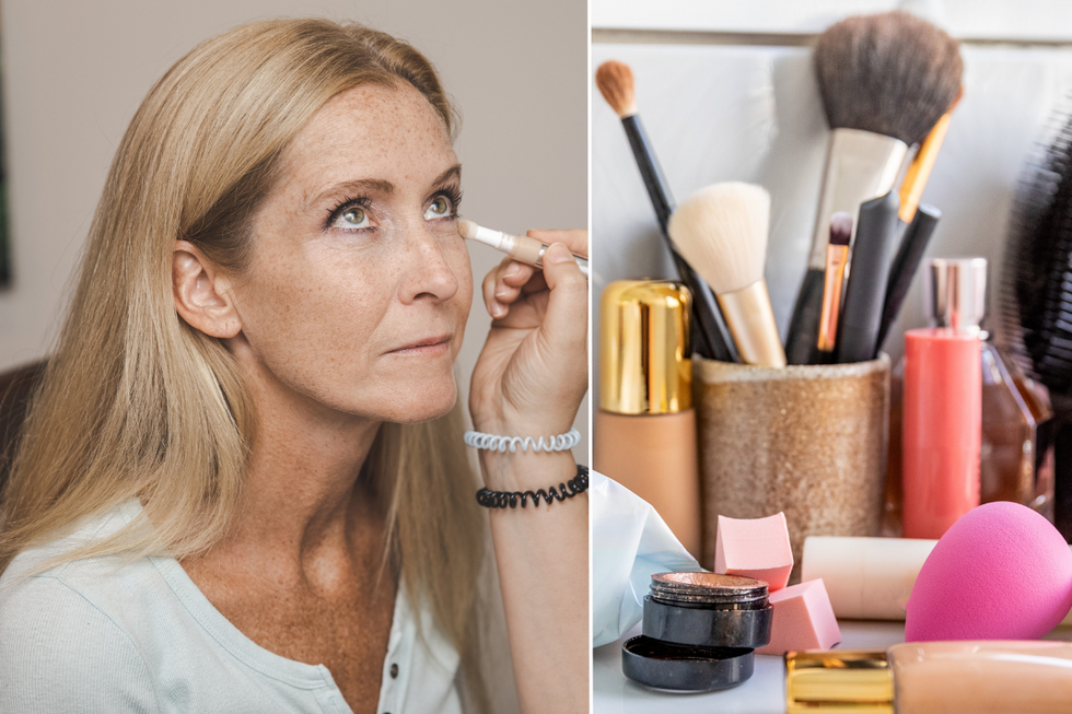 Woman applying concealer / make up products