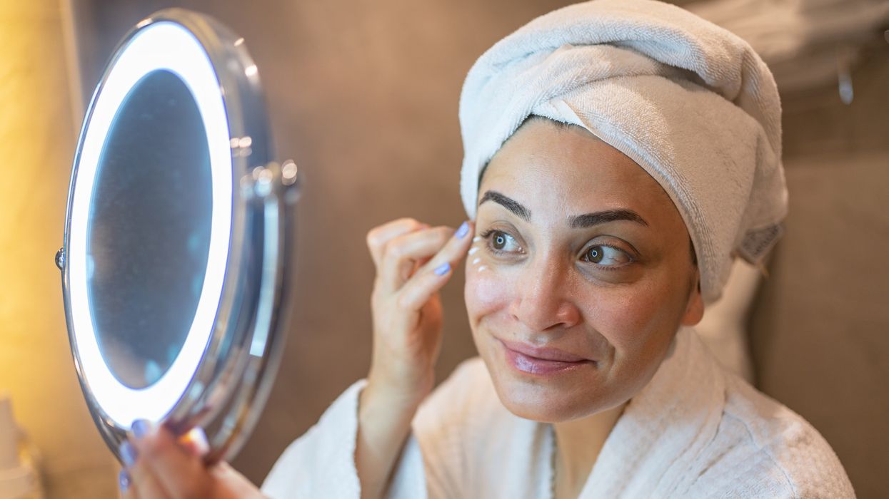 Woman applying eye cream