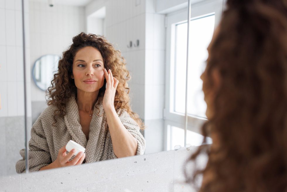 Woman applying eye cream