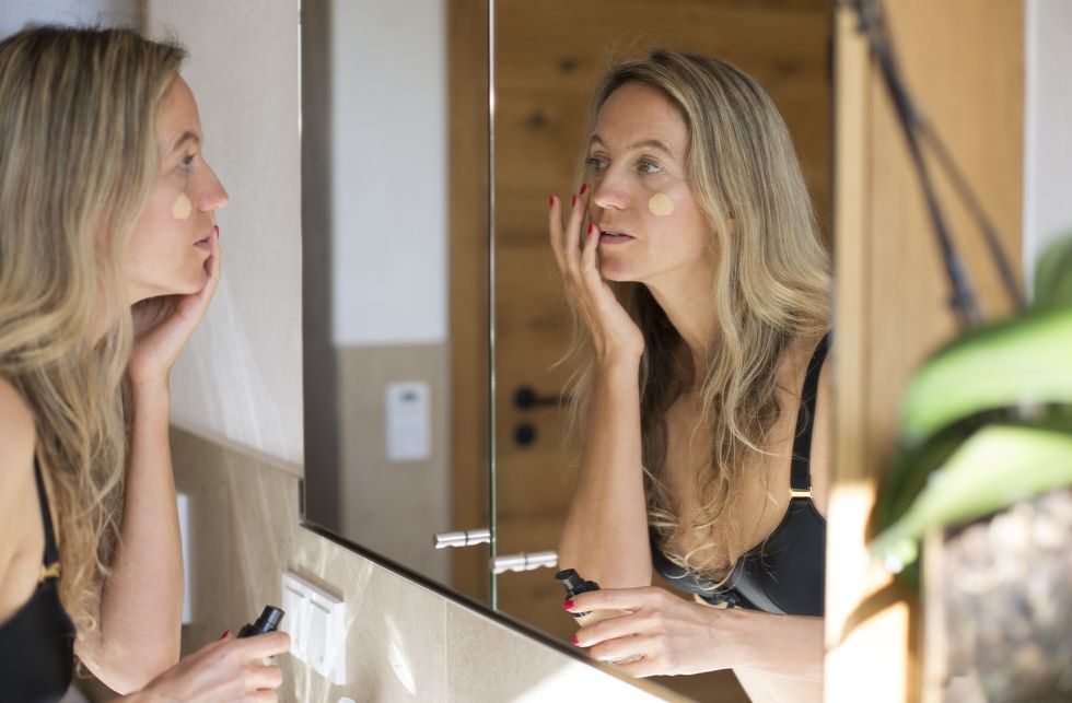 Woman applying foundation